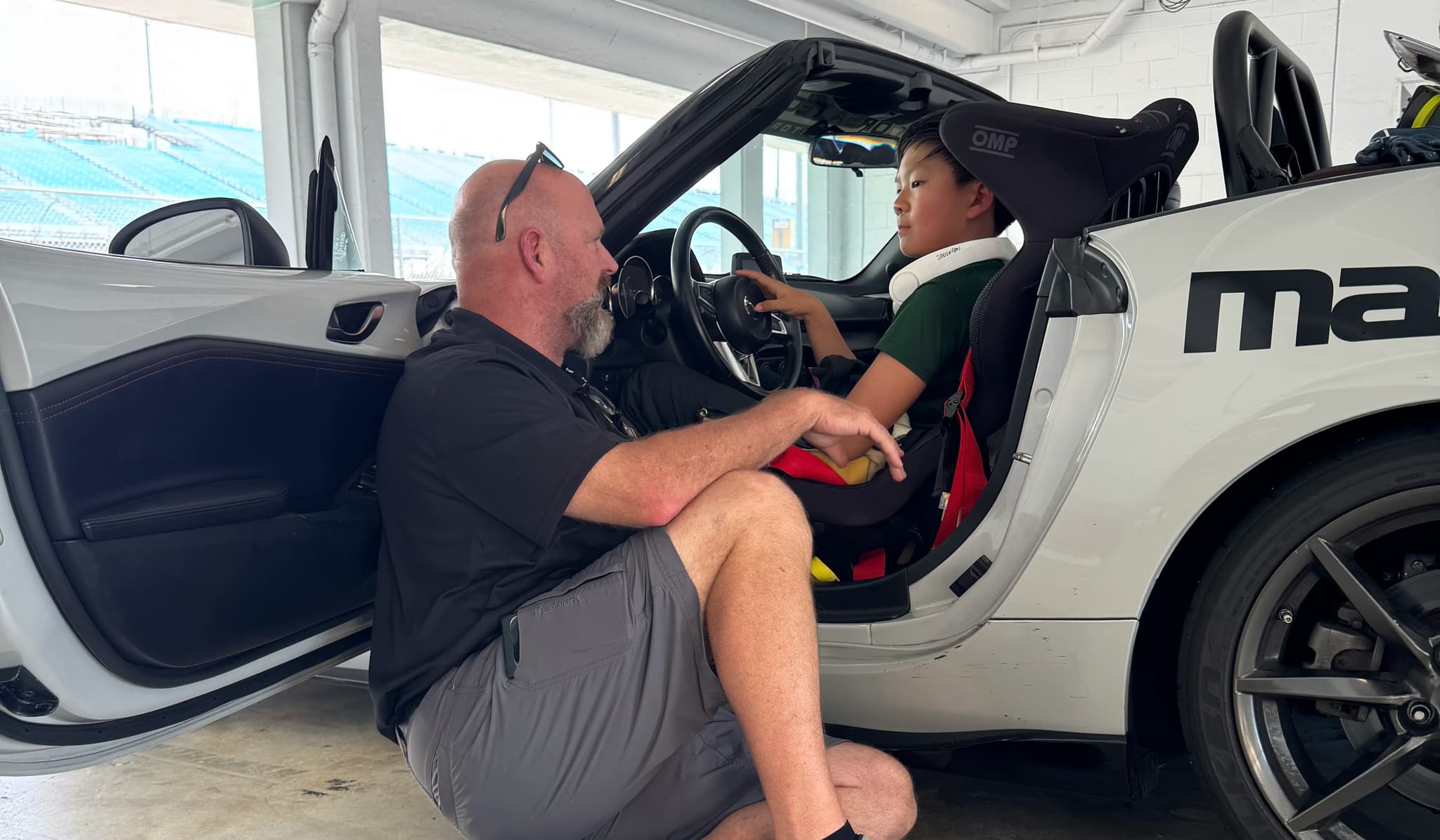 Joseph Saddington receiving coaching in the car